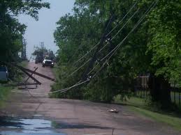 fallen power lines blocking a road