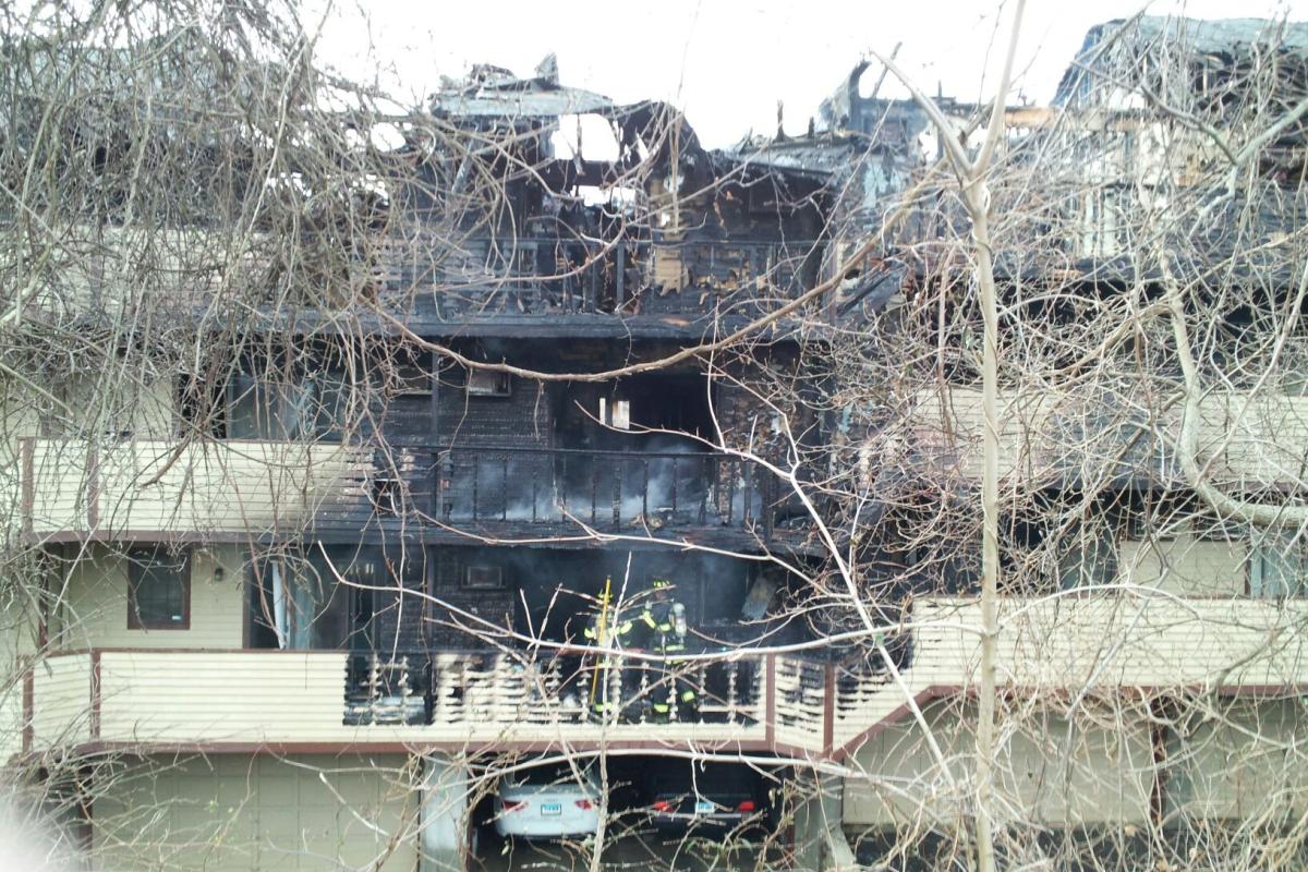 Apartment complex with part of it destroyed after a fire